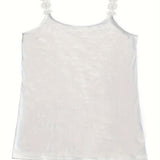 Elegant women's black ruffled sleeveless tank top showcasing a chic and formal design with intricate ruffle detailing along the neckline, styled in a fashion-forward manner.