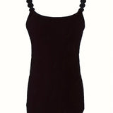 Elegant women's black sleeveless tank top with ruffled details, designed for a formal and chic look.