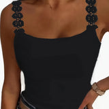 Elegant women's black ruffled sleeveless tank top, showcasing a chic and formal design with a focus on the neckline and shoulders, in size 2XL.