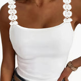 Elegant women's white ruffled sleeveless tank top featuring a chic design with delicate ruffles along the neckline, suitable for formal occasions.