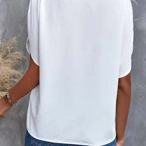 Elegant women's casual chic white blouse with draped back and loose fit, featuring a stylish neckline and relaxed sleeves.