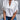 Elegant women's casual chic white blouse with draped back and loose fit, featuring long sleeves, a round neck, and a relaxed silhouette. The blouse is worn by a model paired with jeans, showcasing a comfortable and stylish look.