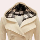 Elegant cream double-breasted pea coat for women featuring a checkered hood, showcased on a model. The coat exhibits stylish design elements such as a structured collar and tailored sleeves, complementing an overall sophisticated look.