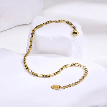 Elegant women's designer gold bracelet featuring intricate detailing, fine metal craftsmanship, and luxurious finish, showcased as a premium fashion accessory and jewelry.