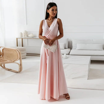 Elegant women's formal pale pink V-neck maxi dress, featuring a flattering waistline and flowing skirt, suitable for bridesmaid or evening wear.