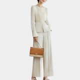Elegant women's high-waist trouser suit with pleated blouse, featuring long sleeves and tailored fit.