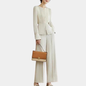 Elegant women's high-waist trouser suit with pleated blouse, featuring long sleeves and tailored fit.