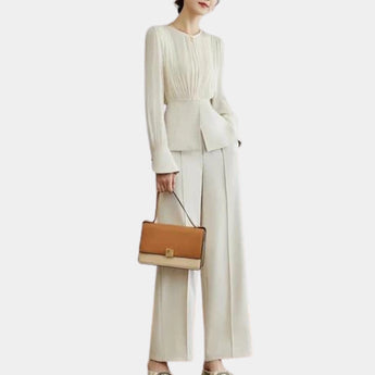 Elegant women's high-waist trouser suit with pleated blouse, featuring long sleeves and tailored fit.