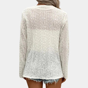 Elegant women's ivory blazer with a tailored fit, featuring a stylish collar, long sleeves, and waist detailing. The lightweight and breathable design offers a fashionable outerwear option.