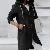 
A stylish black long hooded cardigan designed for women, featuring an asymmetrical zipper, long sleeves, and a flattering fit in size 5XL. The cardigan is worn by a model showcasing fashion-forward outerwear style, complemented by sunglasses.