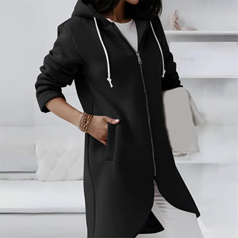 
A stylish black long hooded cardigan designed for women, featuring an asymmetrical zipper, long sleeves, and a flattering fit in size 5XL. The cardigan is worn by a model showcasing fashion-forward outerwear style, complemented by sunglasses.