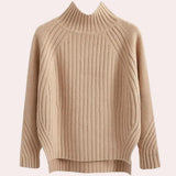 Elegant cream-colored women's ribbed mock neck sweater featuring a turtleneck design, long sleeves, and a cozy knit texture, shown in an apricot XL size.