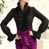 Elegant women's ruffle blouse in nero, featuring a classic French fashion design with a distinctive collar, long sleeves, and a fitted waist.