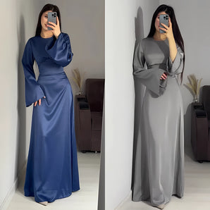 Elegant women's long sleeve satin evening gown in purple, featuring a formal maxi dress design.