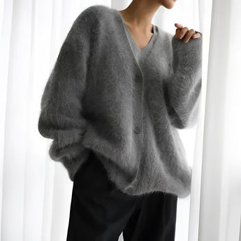 Elegant dark gray oversized sweater for women in plush soft fur fabric, featuring long sleeves, a high collar, and a relaxed fit, perfect for winter fashion.