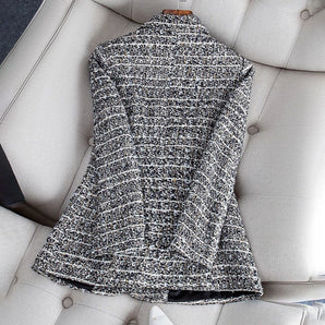 Elegant women's tweed blazer in a chic monochrome pattern, featuring a stylish shoulder design and suitable for formal office wear.
