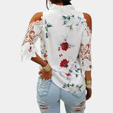 Elegant women's white floral lace cold shoulder top featuring bell sleeves and intricate lace detailing.