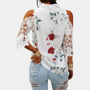 Elegant women's white floral lace cold shoulder top featuring bell sleeves and intricate lace detailing.