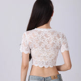 Elegant women's white floral lace crop top with short sleeves and a fitted waist, showcasing intricate lace detailing and a stylish summer design.