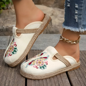 Embroidered floral espadrilles featuring a boho chic design, slip-on style with azure and white detailing, perfect for summer fashion.
