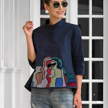 Embroidered snap button hoodie in a colorful geometric design, displayed in blue, size 3XL. The hoodie is showcased with a focus on its outerwear style, potentially worn with jeans.