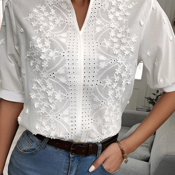 White short-sleeve embroidered floral lace blouse with eyelet details, featuring a dress shirt style and fashionable neckline.
