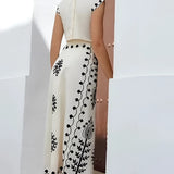 A woman wearing an embroidered white linen midi dress, featuring a sleeveless design suitable for summer. The dress has a fitted waistline and falls to knee-length, embodying a casual yet stylish day dress look.