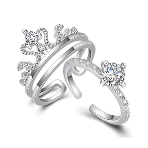 A silver emerald-cut solitaire diamond ring on a finger, showcasing its elegant design suitable for bridal and engagement ceremonies.