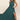Emerald green chiffon halter neck maxi dress, shown in dark green, size 2XL, featuring a flowy design ideal for bridesmaids or gala events. The dress highlights the shoulders and waist, with a sleeveless style and elegant draping.