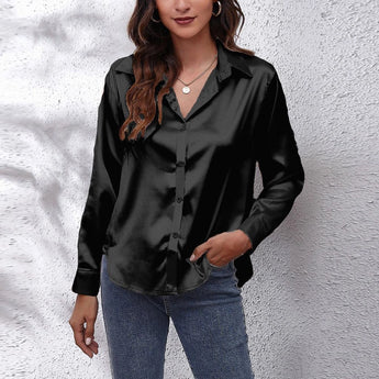Emerald green satin long sleeve button-down blouse with a classic collar and tailored fit, suitable for fashion-forward occasions.