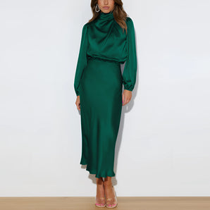 Emerald green satin long sleeve high neck evening dress in a dark green color, designed with a fitted waist, knee-length hemline, and elegant collar suitable for formal occasions.