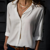Emerald green long sleeve silk blouse, luxurious satin fabric, suitable for spring fashion.