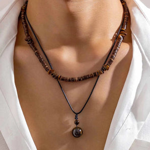 Ethnic Tribal Wooden Bead Necklace in Brown - Bohemian Adjustable Statement Jewelry displayed around a neck, highlighting its intricate beadwork and natural wooden texture.