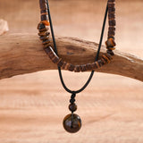 Ethnic Tribal Wooden Bead Necklace with Bohemian Adjustable Design on Display.