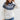Fair Isle Women's Crew Neck Nordic Knit Sweater in white, size 2XL, featuring long sleeves and a cozy fit, worn by a smiling woman.