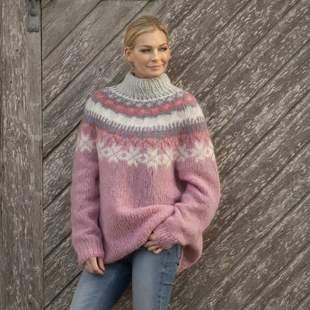 Nordic winter pullover in pink, featuring a Fair Isle pattern, woolen texture, and long sleeves, displayed on a mannequin against a neutral background.