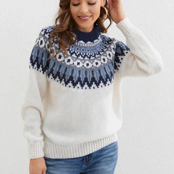 White Fair Isle wool sweater in size 2XL, featuring a Nordic winter pullover design. The model is smiling and the sweater has long sleeves, showcasing its handmade, ethical fashion craftsmanship.