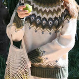 Handmade ethical wool sweater in green with Nordic fair isle pattern, featuring long sleeves, round neckline, and designed for 2XL size.