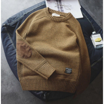 Fashionable women's khaki sweater with suede elbow patches, featuring a cozy knit design. The sweater is shown in size 4XL, highlighting its long sleeves and comfortable fit.