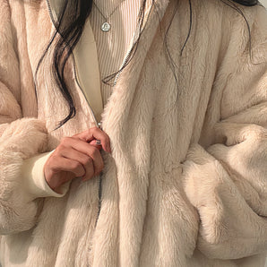 Cream faux fur oversized jacket for women, featuring stylish winter wear design with long sleeves, a high neckline, and beige textile.