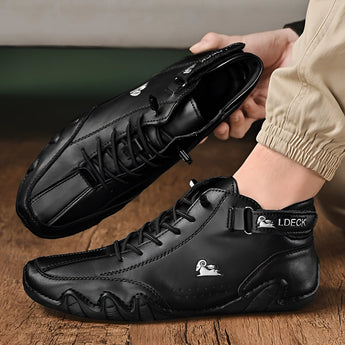 Men's white high-top designer sneakers with urban streetwear style, featuring a sleek design and athletic build suitable for both fashion and outdoor activities.
