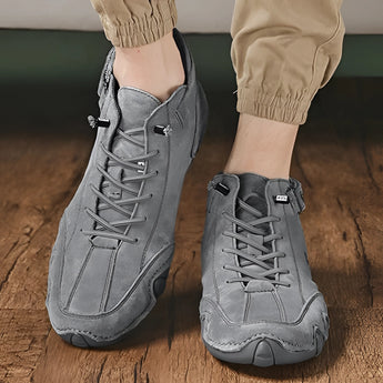Men's white high-top sneakers made from Grigio leather, featuring a sleek urban streetwear design suitable for walking and athletic activities.