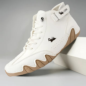 Men's white high-top designer sneakers styled for urban streetwear, featuring a sleek and modern design ideal for outdoor activities and walking.
