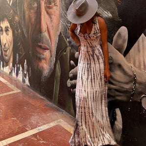 Floor-length white and beige summer dress with tie-back and abstract print in khaki, size XL(44), displayed on a mannequin with a sun hat.