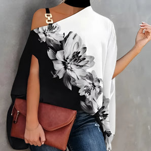 Floral asymmetric one-shoulder blouse in black and white with a large floral pattern, shown in a white color variant and size 2XL, styled for evening wear.