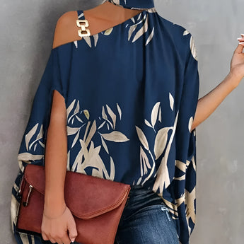 Floral asymmetric one-shoulder blouse in navy blue, suitable for evening wear, showcasing a stylish design on a model highlighting the shoulder and neck area.
