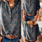 Floral Boho Chic women's blouse featuring long sleeves and a mandarin collar, paired with jeans. The blouse is white with intricate floral patterns, highlighting a fashionable and elegant design.