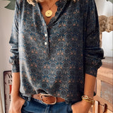 
A 3XL Floral Boho Chic Women's Blouse featuring long sleeves, a mandarin collar, and intricate textile design, showcasing a fashion-forward, relaxed style.