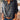 
A 3XL Floral Boho Chic Women's Blouse featuring long sleeves, a mandarin collar, and intricate textile design, showcasing a fashion-forward, relaxed style.