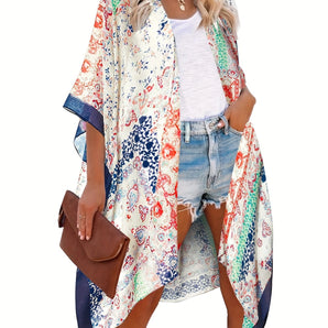 Woman wearing a Floral Boho Kimono Cardigan, paired with jeans, standing outdoors near plants.
